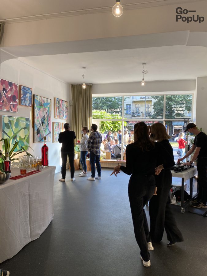 Gathering of people to attend an art event at the pop-up location